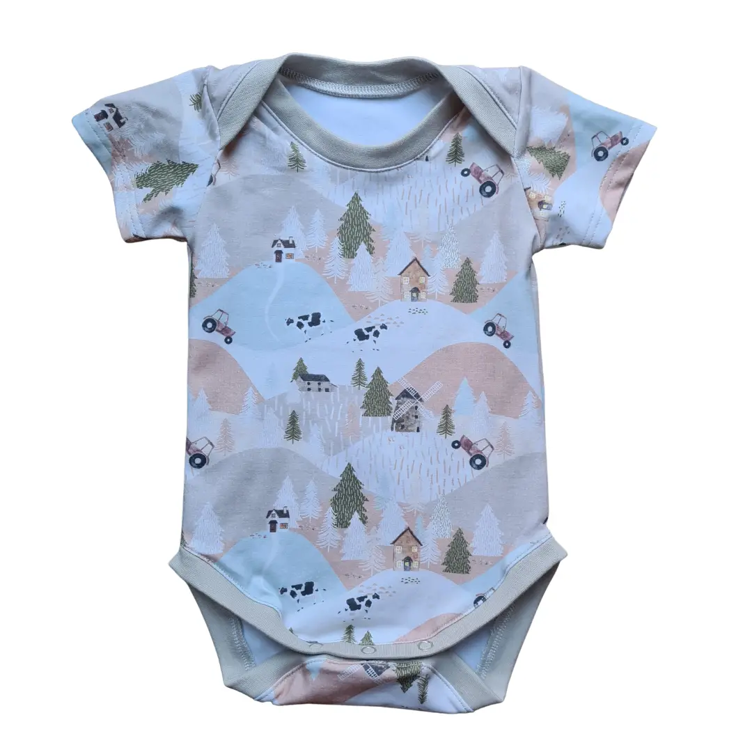 baby vest with tractors, cows and trees